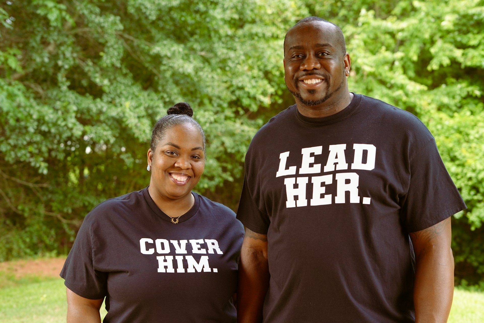 a man and a woman smiling